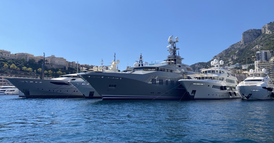 Line of yachts in-show at the Monaco Yacht Show 2021