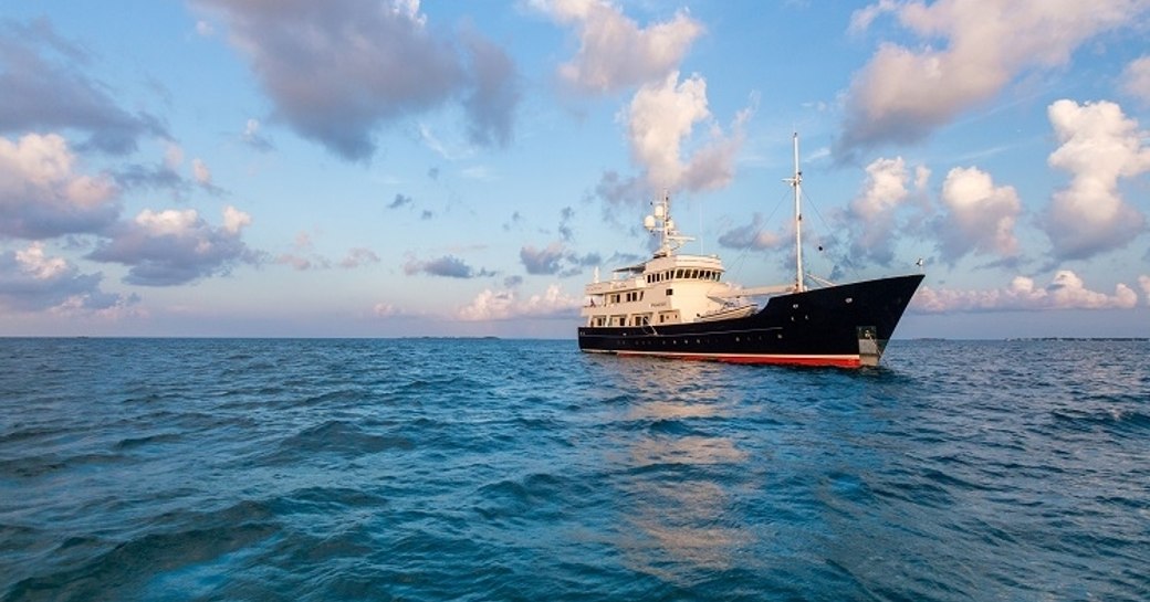 superyacht PIONEER anchors for the sunset on a luxury yacht charter in Alaska