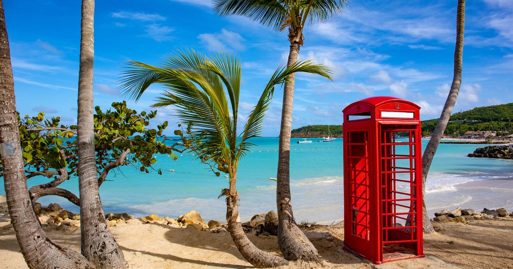 A British red telephone box on a beach in the British Virgin Islands