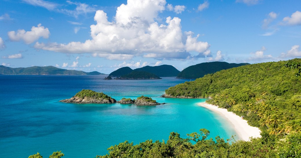 An image which shows the turquoise blue waters and white sands of a British Virgin Island beach