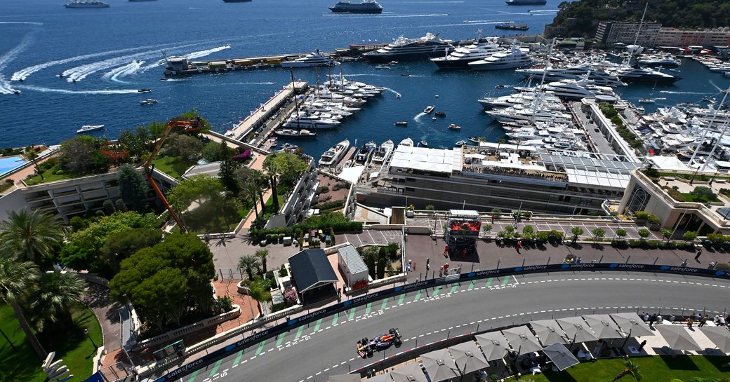 Elevated view of Monte Carlo with a race car on the Circuit de Monaco track