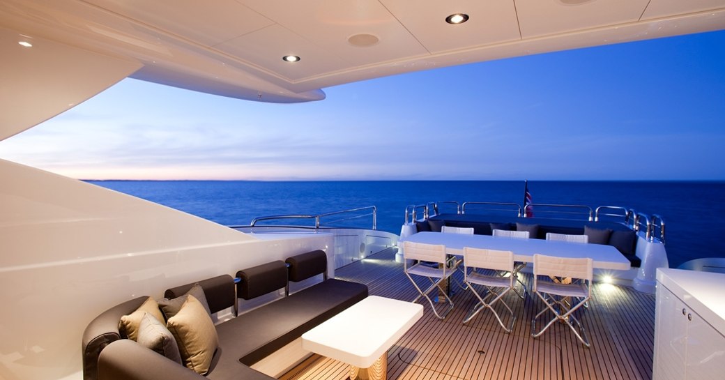 alfresco lounge and dining on aft deck of motor yacht QUANTUM 