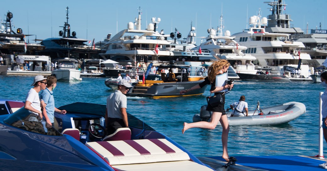 Tenders take visitors to anchored yachts at the MYS 2021