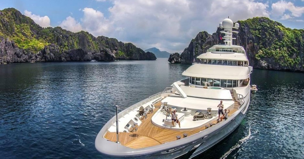 Charter guests enjoy the outdoor deck of luxury yacht TV