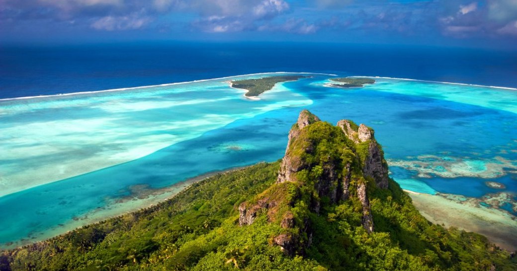 the coast of Tahiti accessible by luxury charter yacht