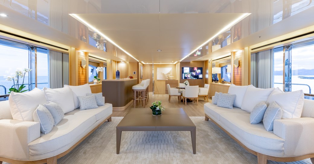 white sofas form a sociable seating area on board a superyacht 