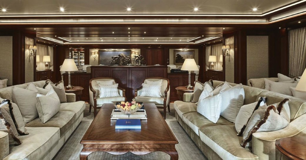 Main salon with plush seating aboard luxury charter yacht ARETI