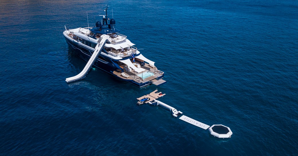 Aerial view looking down on charter yacht LIV LOVE with water toys deployed