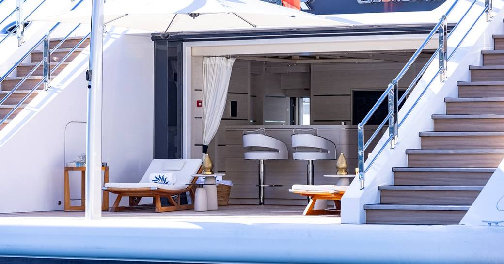Charter yacht LUNA beach club sun loungers and entrance