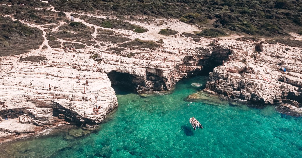 blue water and rocky cliffs