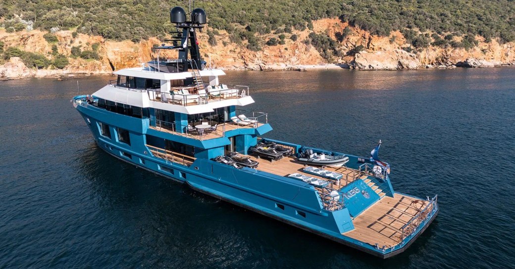 Aft view of private yacht charter KING BENJI at anchor in a bay