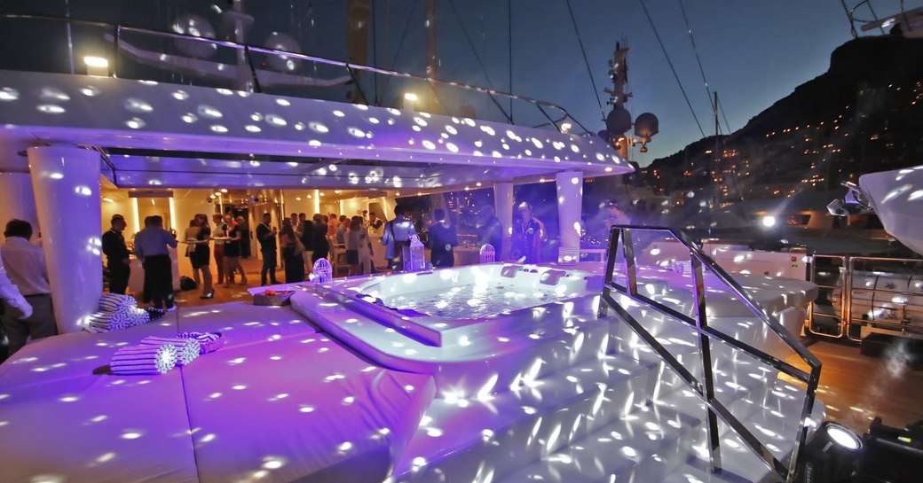 guests gather for a party on the sundeck of superyacht KATINA