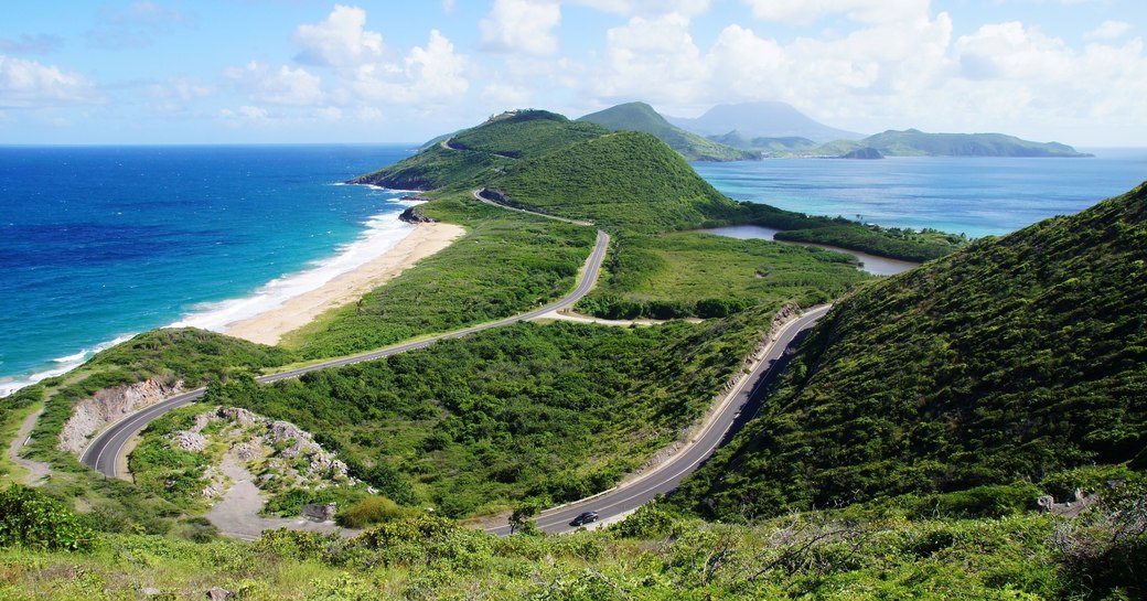 Scenic view from elevated overlook towards St. Kitts isthmus and Nevis Island, St. Kitts