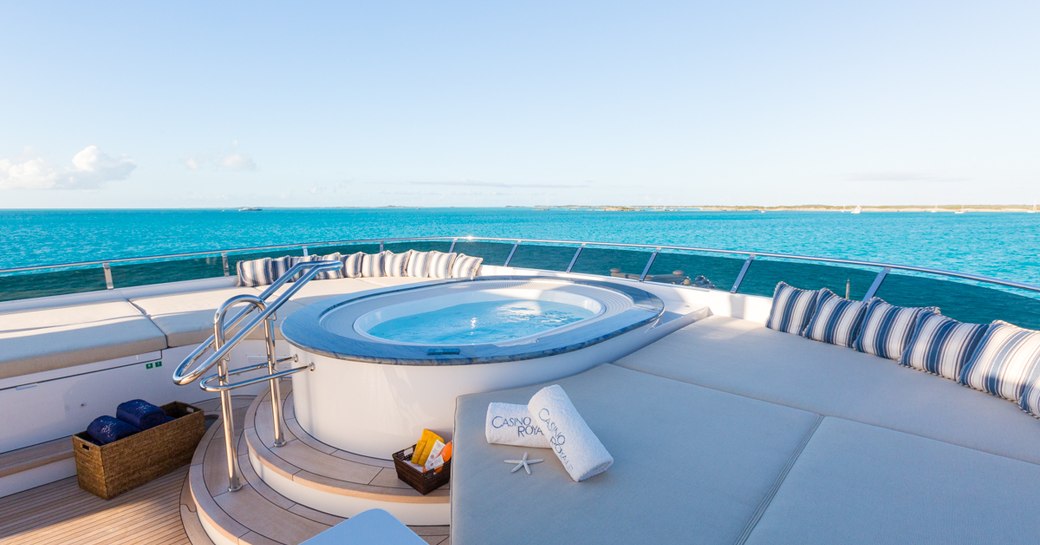 A Jacuzzi fixed on board a superyacht with blue ocean in the background