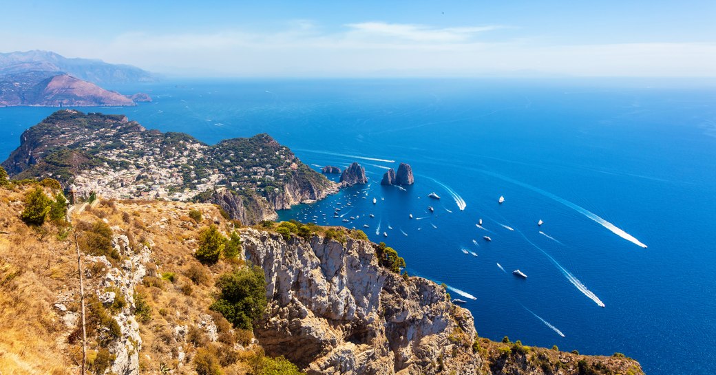 aerial shot of yachts in the island of capri