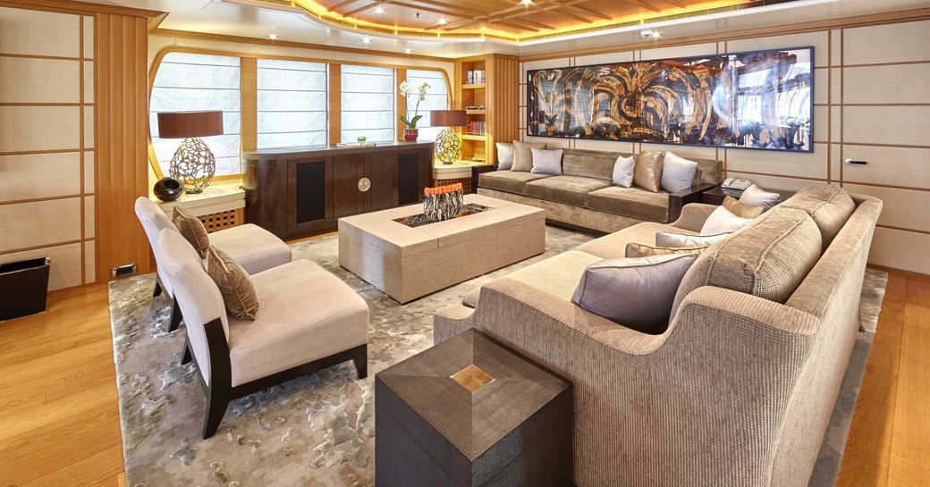 sofas and arm chairs in the main salon of superyacht HANIKON 