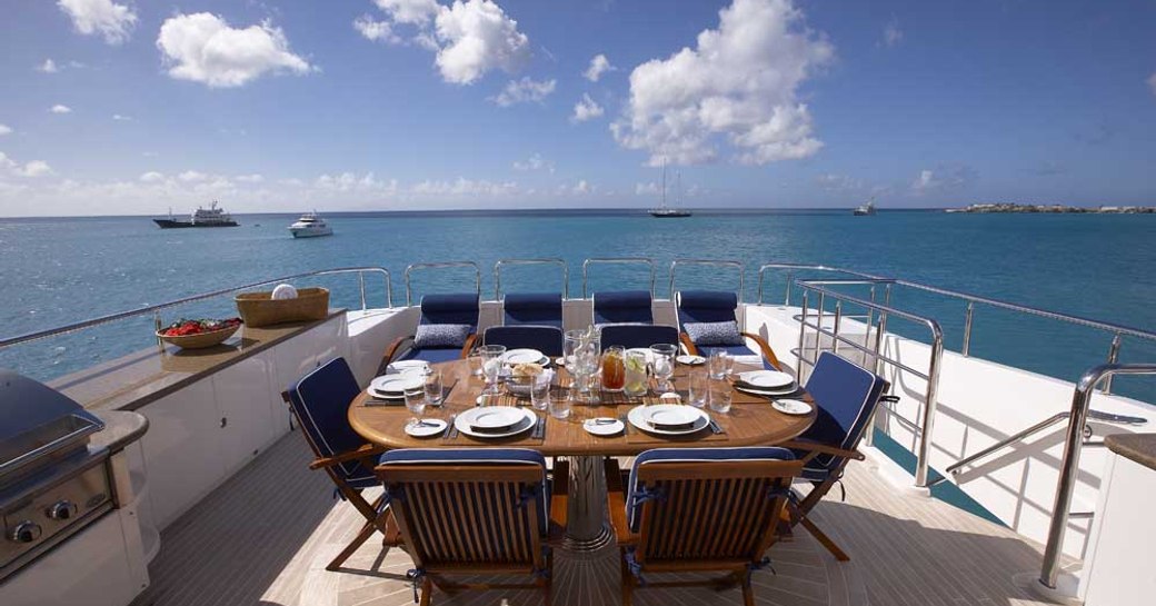 al fresco dining table on the sundeck of motor yacht Lady Leila 