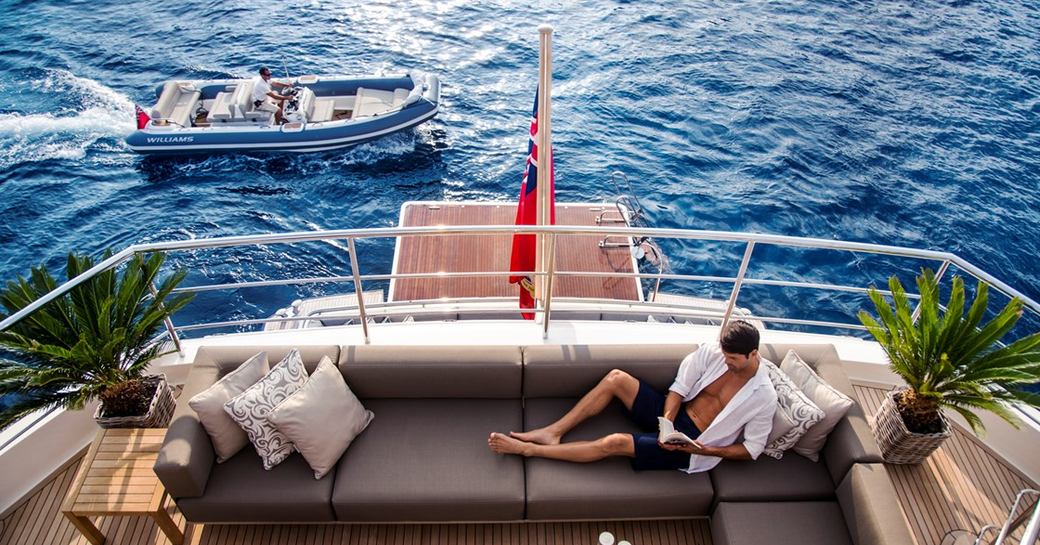 Man relaxing on luxury charter yacht