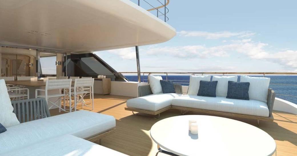 Exterior seating area with white sofas onboard charter yacht DAWO