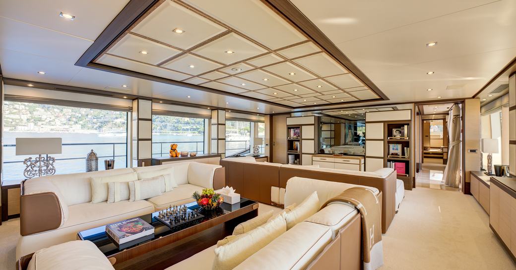 Interiors onboard charter yacht NELA with plush lounge and neutral decor