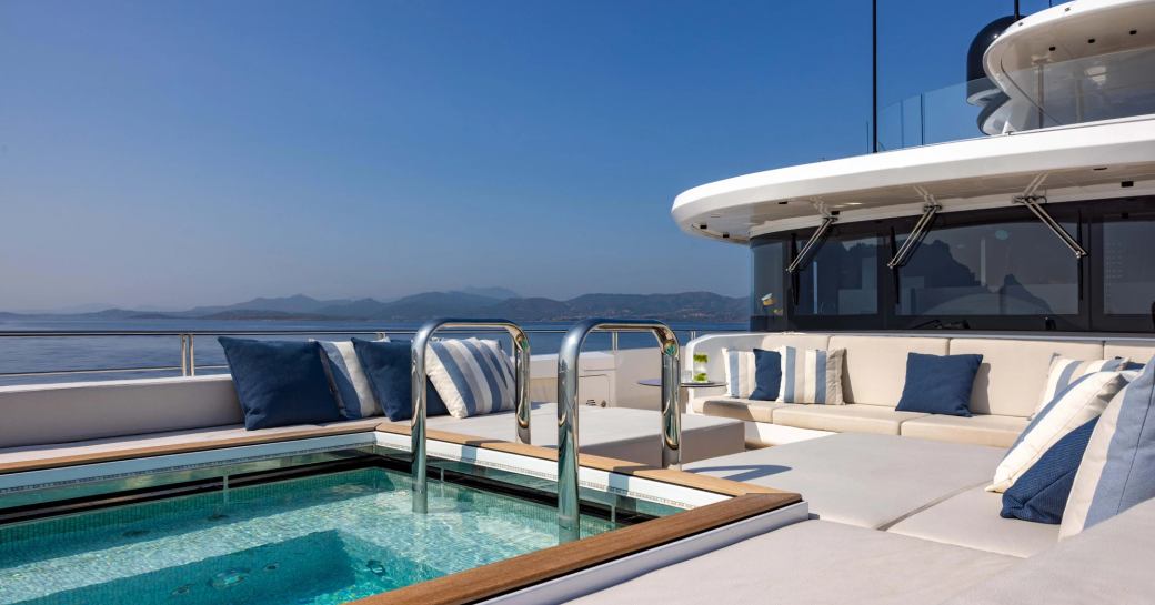 Swimming pool and sun pads onboard charter yacht ACQUA CHIARA