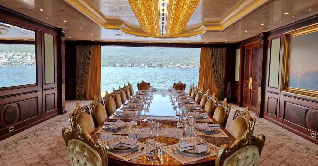 Formal dining area with open view of exteriors onboard charter yacht BLACK PEARL