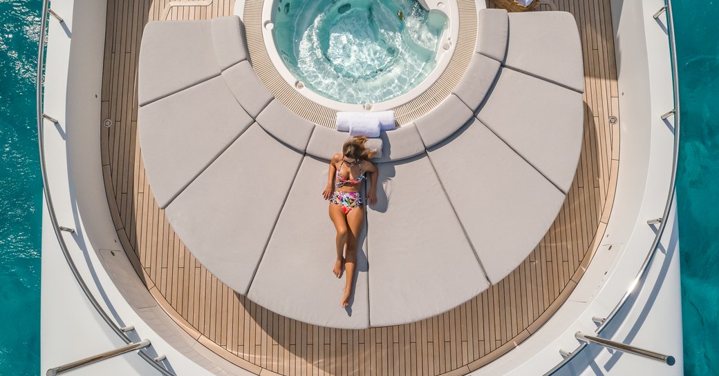 Jacuzzi and sun pad area on board charter yacht BIG SKY