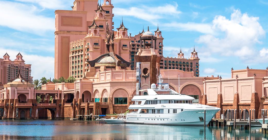 Exteriors of the Atlantis Hotel in the Bahamas with charter yacht berthed 