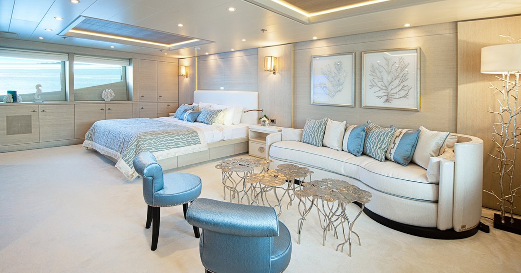 luxury yacht spirit master cabin, with large bed and lounge area