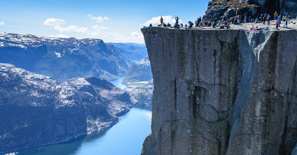 View of cliff in Norway overlooking blue fjord