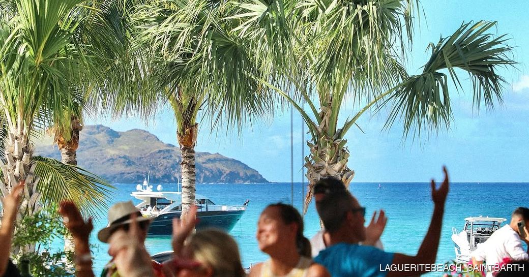 Charter guests dancing round tables at La Guerite St Barts