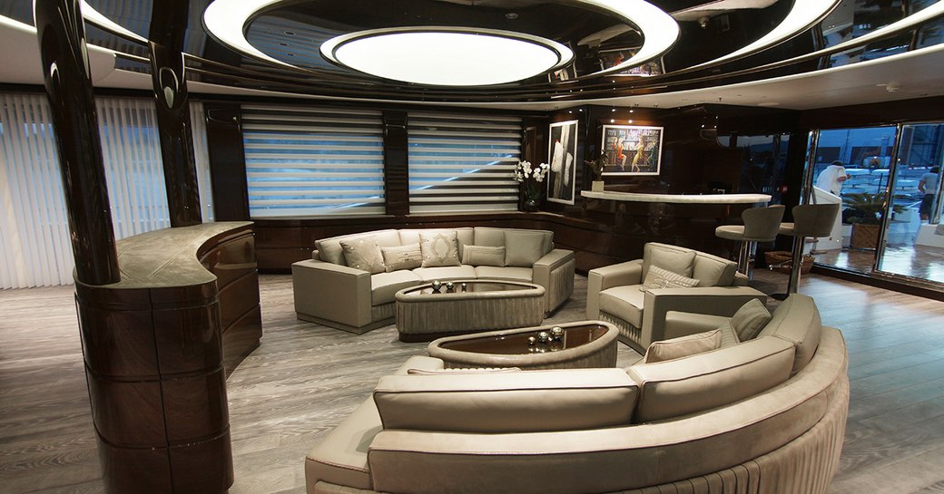 main salon and interiors on superyacht baba's with white sofa seating