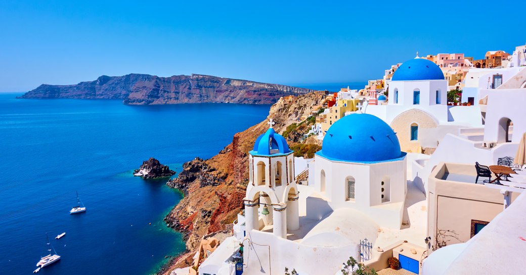 Beautiful white buildings and blue waters in Greece