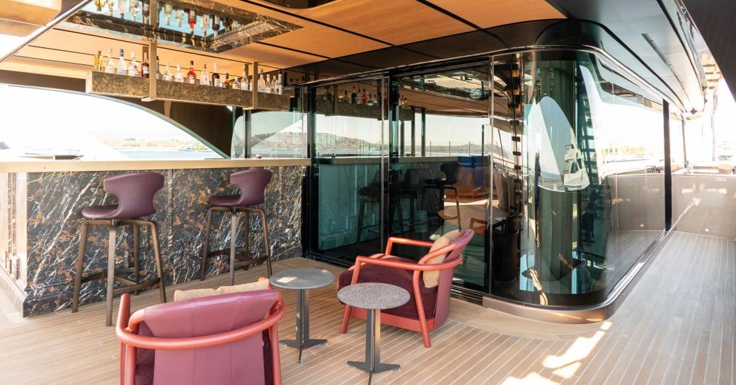 Charter yacht RAJA² exterior wet bar and chairs