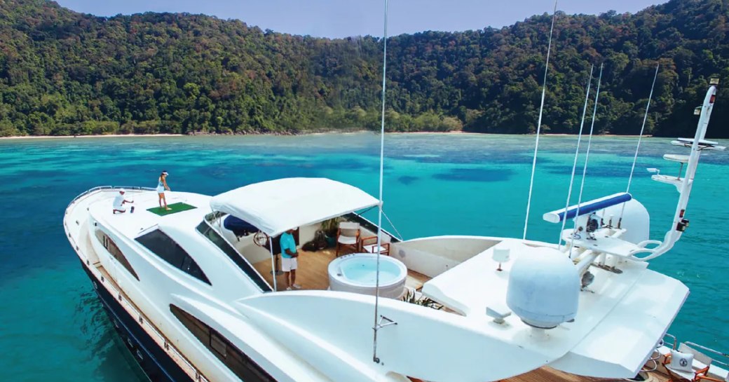 people playing golf on their luxury yacht charter vacation in Thailand