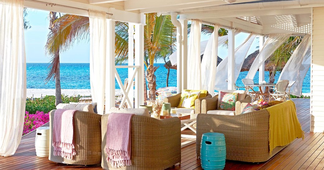 alfresco seating and dining area on terrace outside villas on thanda island