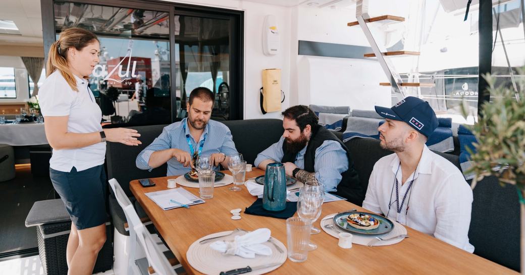 Chef Competition judges with superyacht cuisine and stewardess