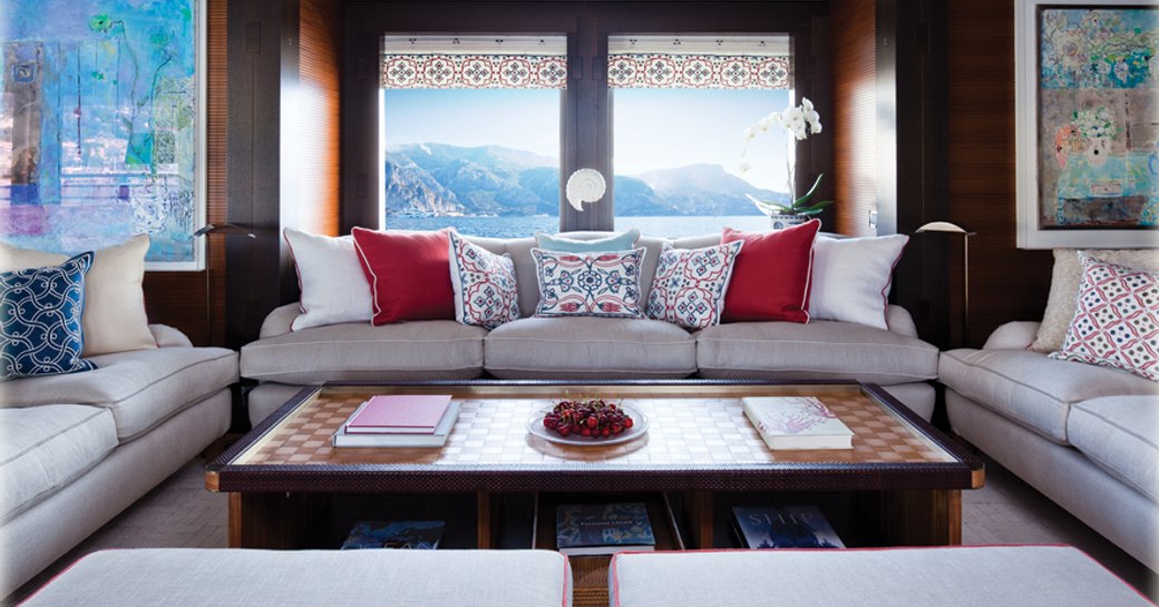 white sofas form a seating area in the main salon of superyacht Baton Rouge 