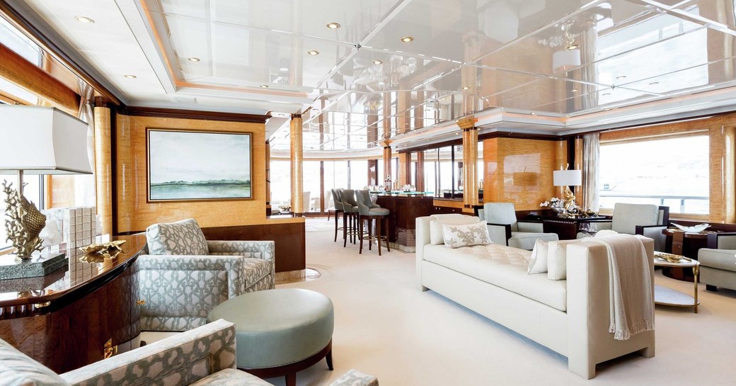 armchairs, sofa and bar in the main salon of luxury yacht Lucky Lady 