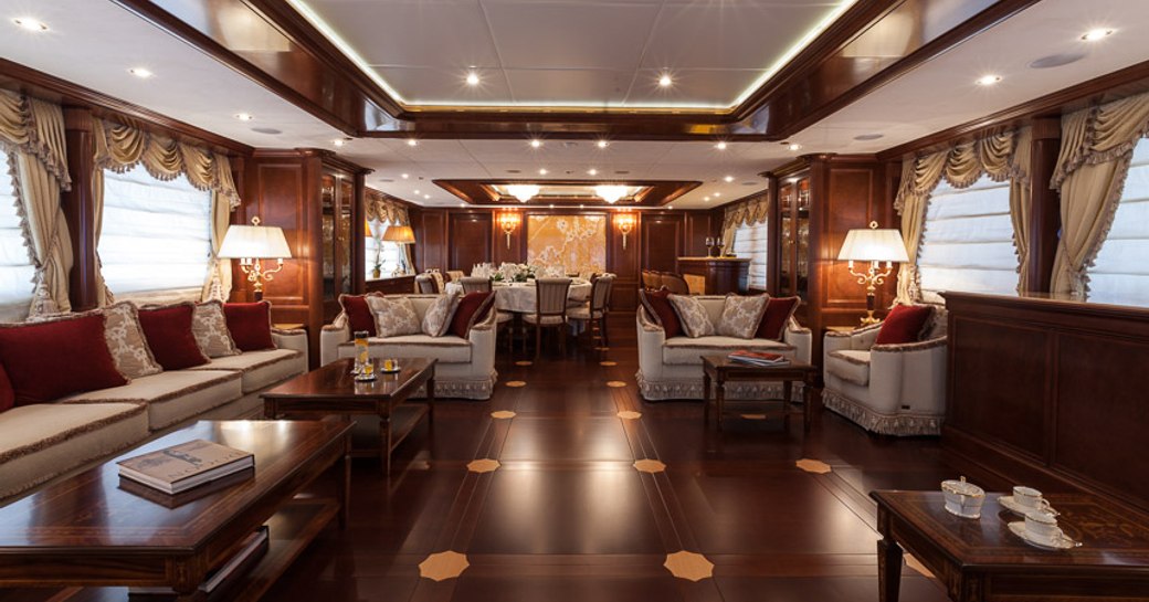 classically styled main salon on board superyacht PRIDE