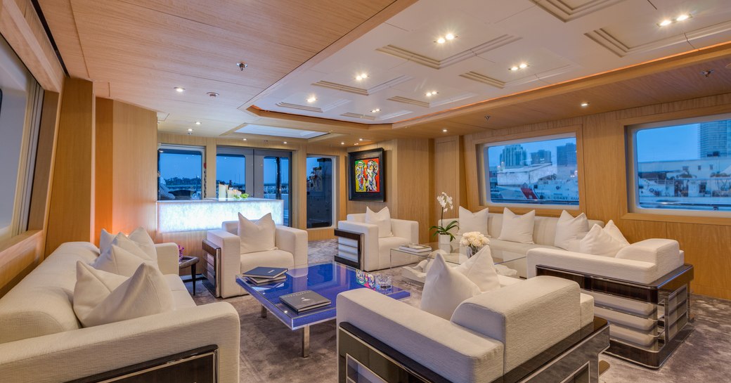 White furnishings around the main salon of superyacht MIZU