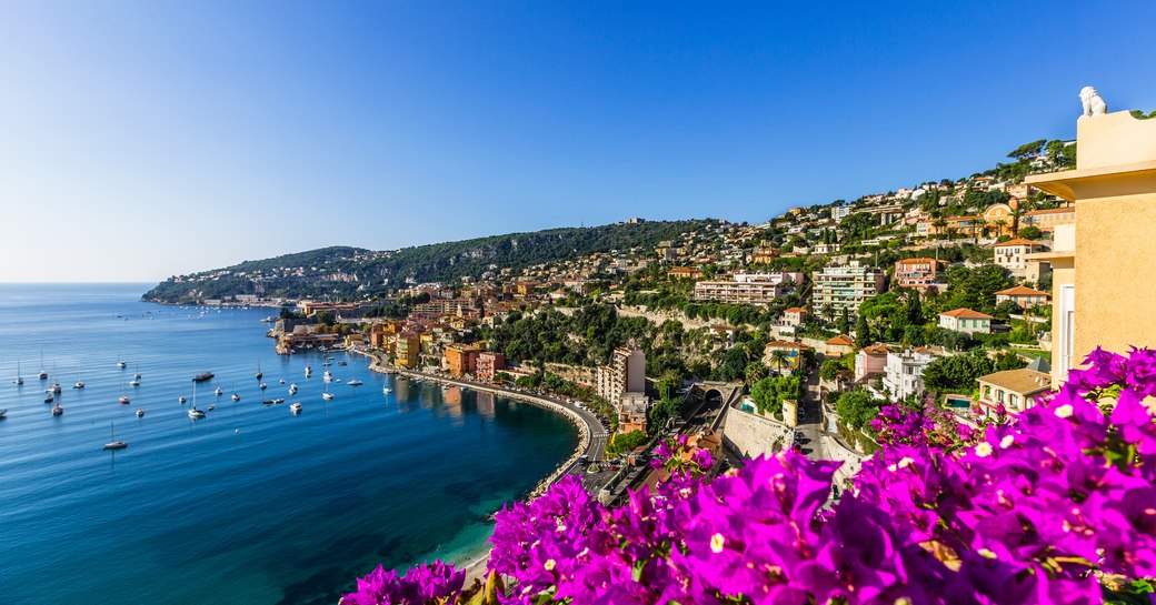 Looking over some bougainvillea at a harbour in the South of France