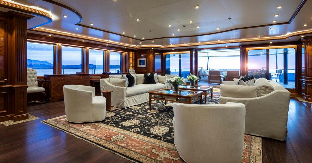 Main salon with plush armchairs onboard charter yacht STARFIRE