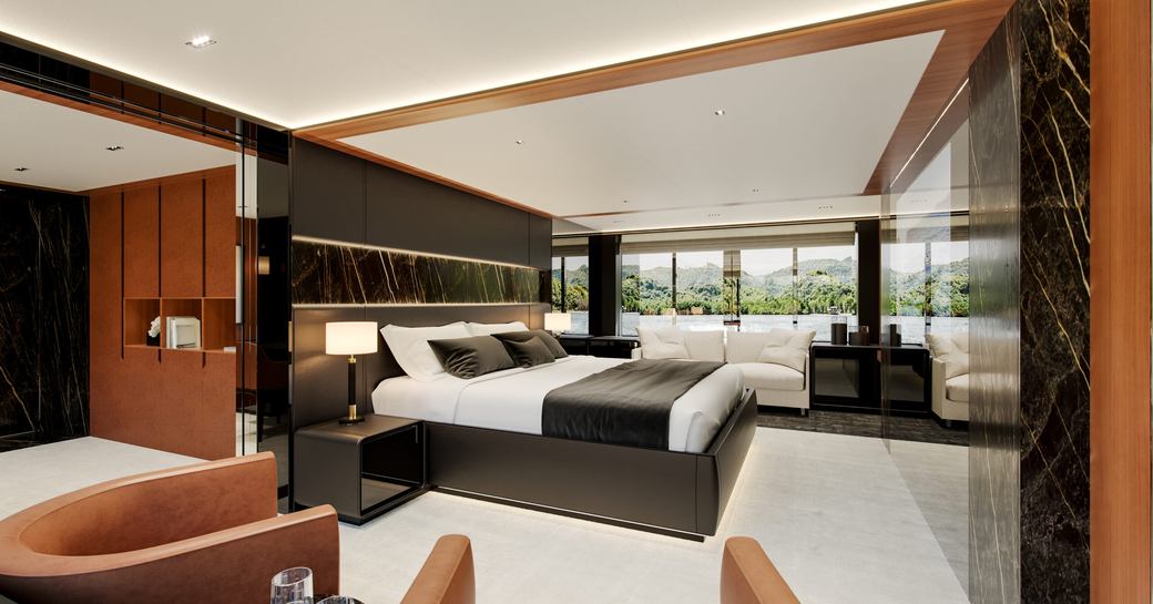 Master cabin onboard charter yacht SAIRU with central berth and large windows