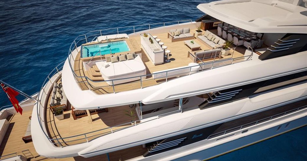 Superyacht SPECTRE sun deck aerial shot with view of glass-rimmed pool and bar area