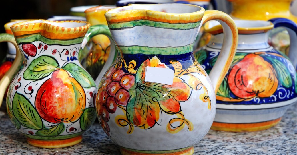 painted ceramic jugs at little shop on italy's amalfi coast