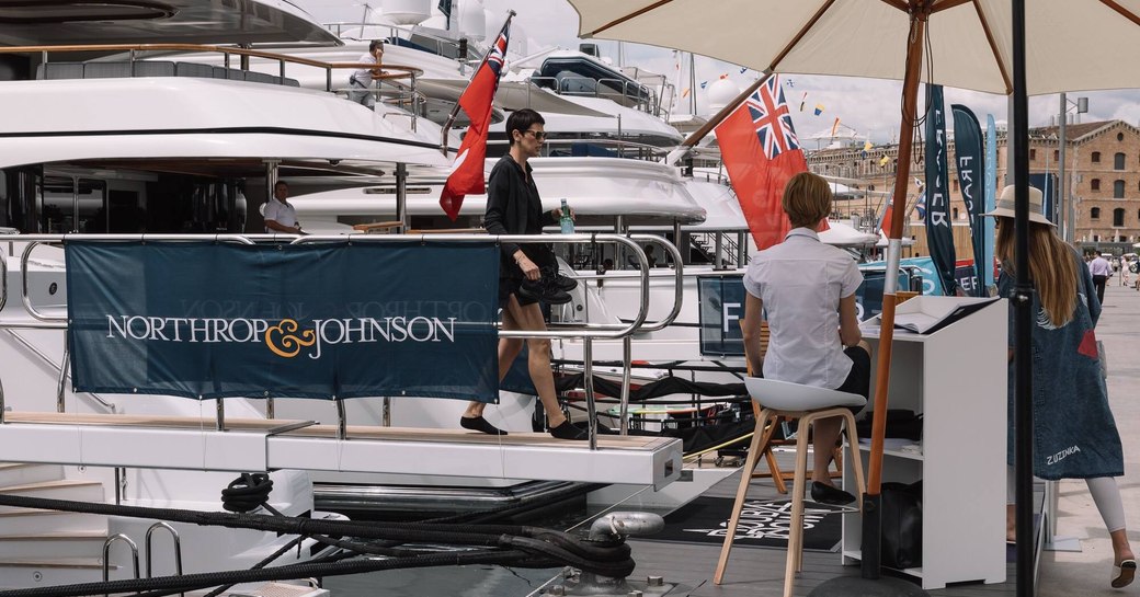 visitor steps of superyacht in OneOcean Port Vell at The Superyacht Show