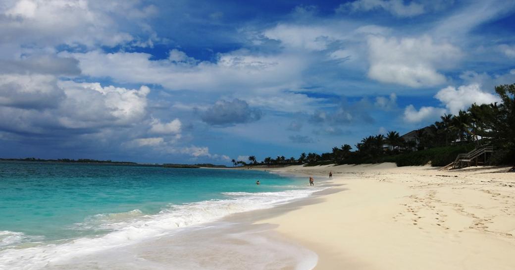 Empty white sandy beach with beautiful blue water