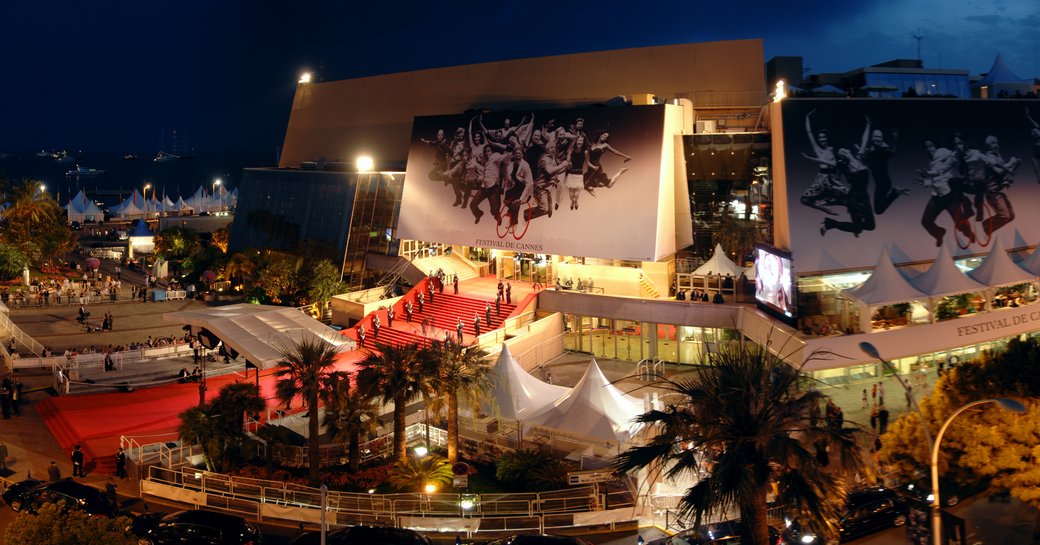 Palais des Festivals with red carpet at night