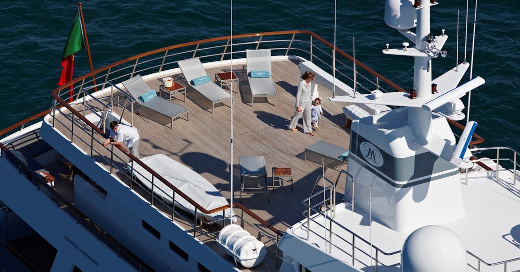 charter guests on sun deck of charter yacht Axantha II